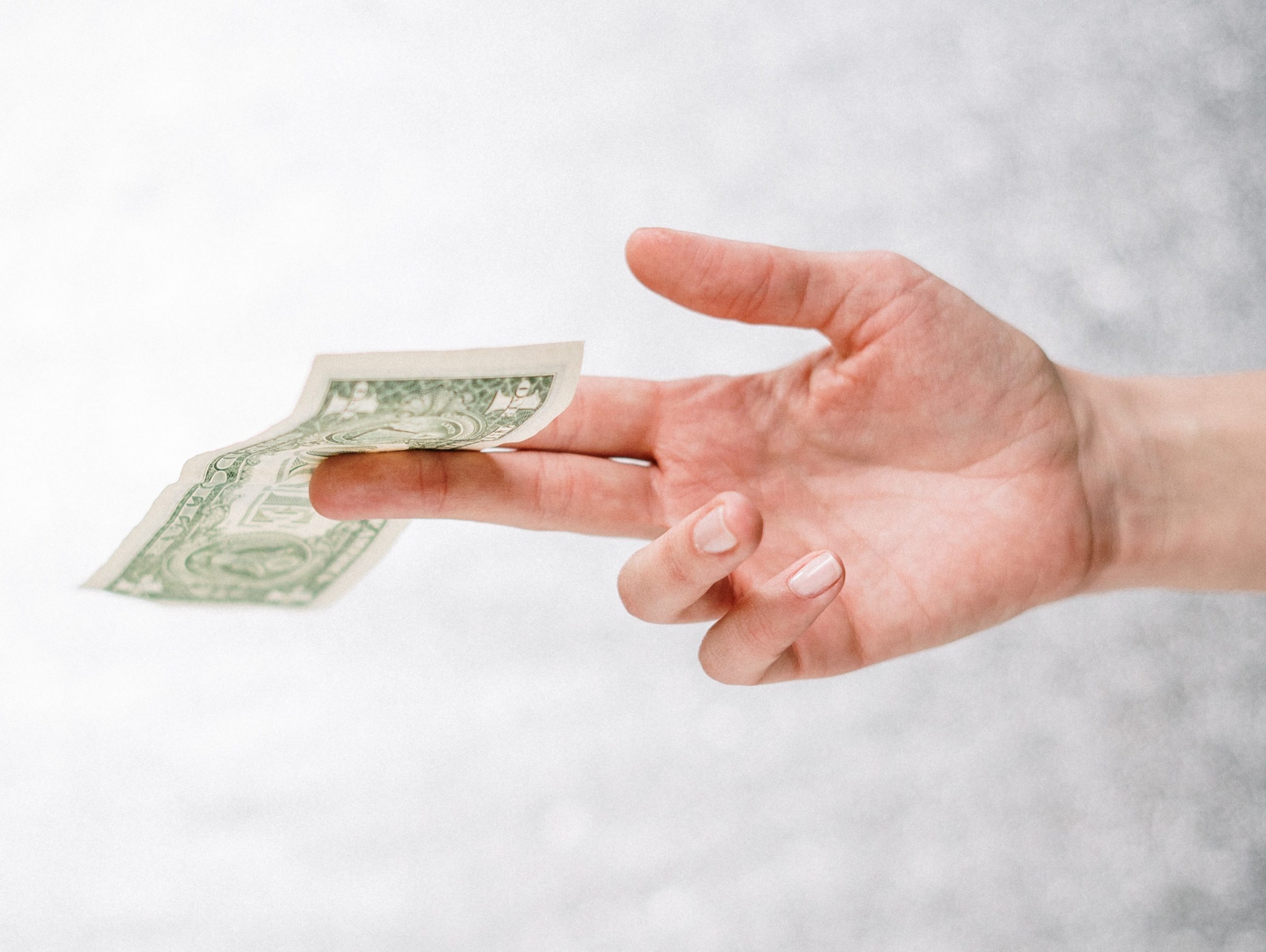 Loan Origination software lending dollar hand giving dollar